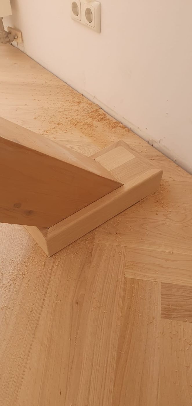 Hand-crafted beam pedestal on herringbone parquet