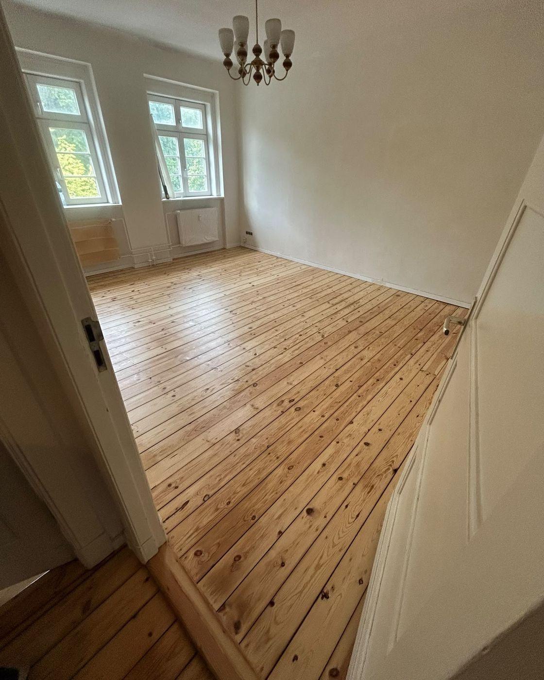 Pine floorboards after sanding and sealing